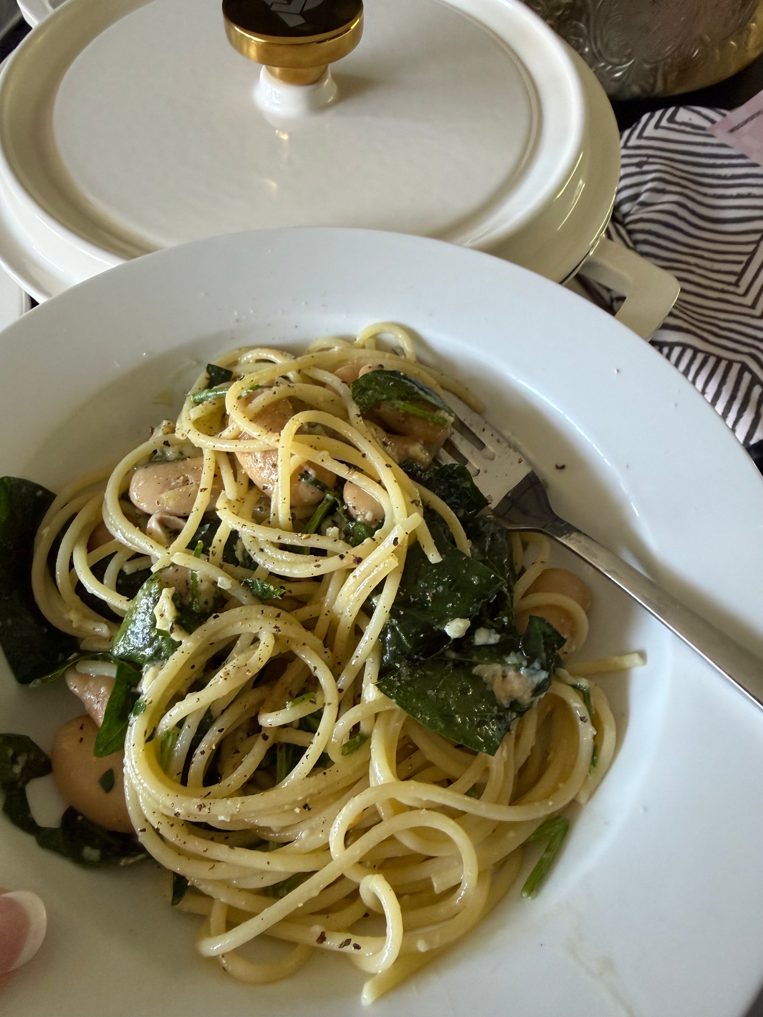Creamy garlic Parmesan chicken spaghetti in a white cast-iron pot